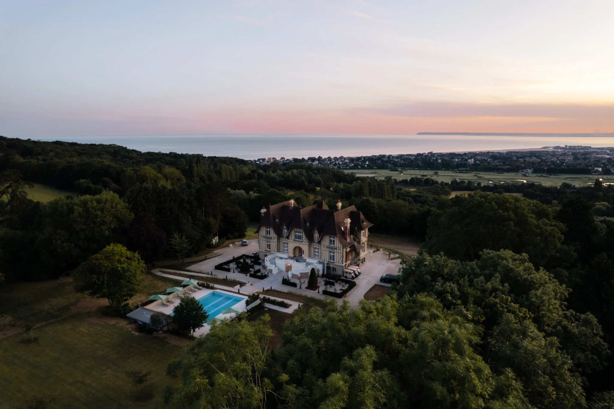 Aerial view of a Normandy estate at golden hour