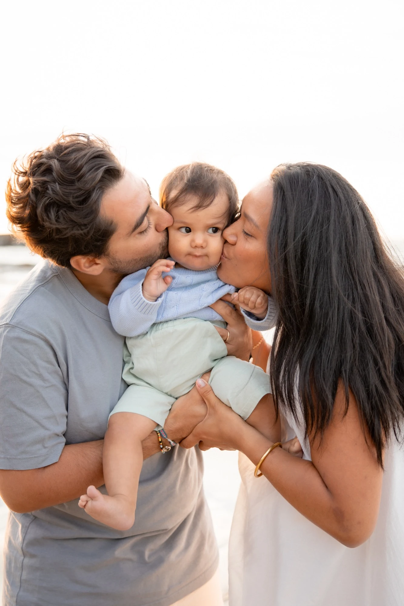Parents share a tender moment with their baby
